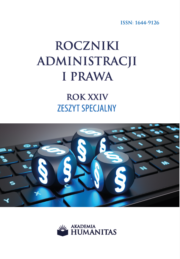Okładka czasopisma naukowego przedstawia klawiaturę komputerową, na której umieszczono podświetlone symbole paragrafu. Grafika nawiązuje do prawa, administracji oraz cyfrowego kontekstu funkcjonowania systemu prawnego. Na okładce widnieje tytuł „Roczniki Administracji i Prawa”, oraz oznaczenie tomu „Rok XXIV, Zeszyt Specjalny”. U dołu znajduje się logo i nazwa wydawcy – Akademia Humanitas.